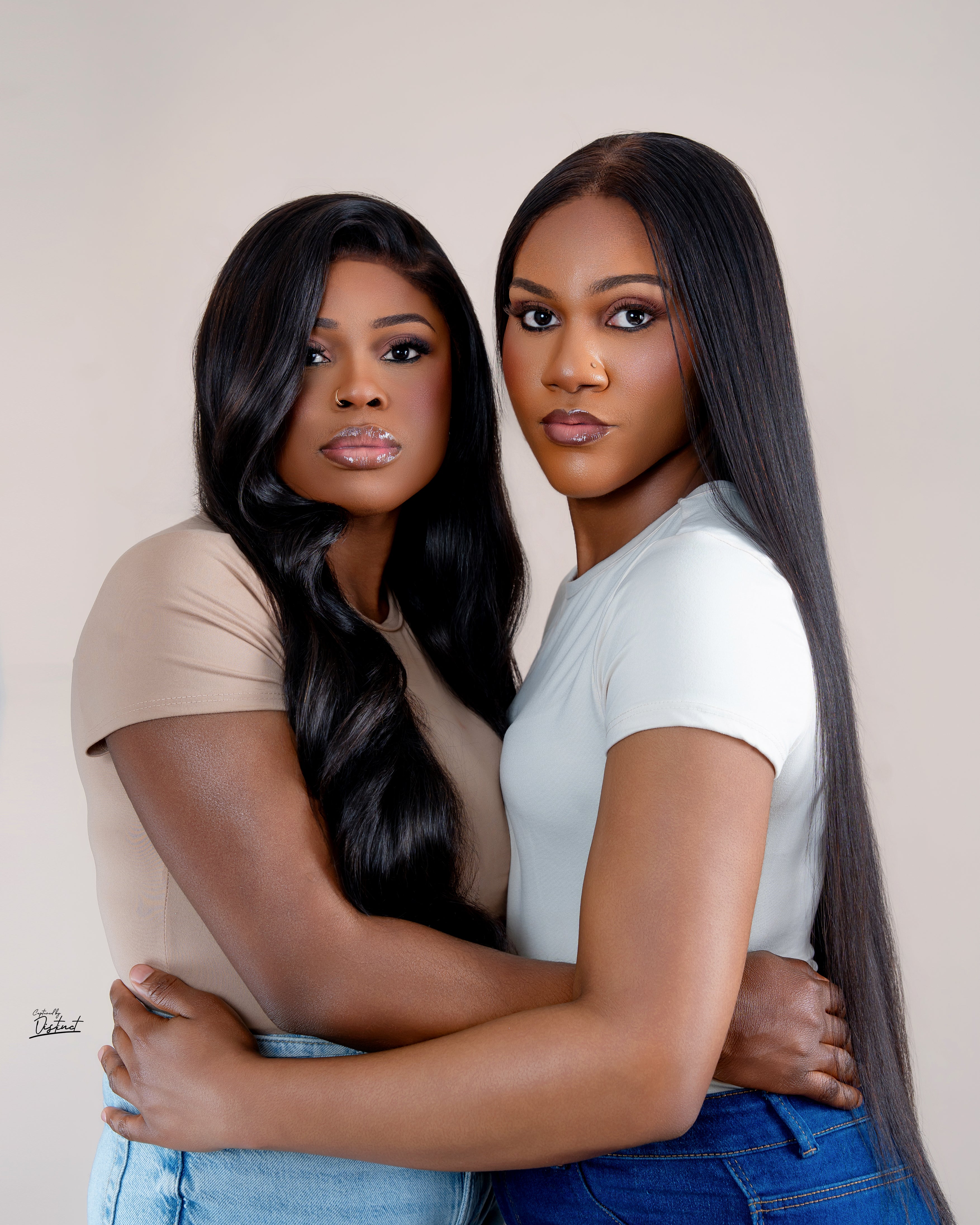 Rennicks Luxe Hair models wearing glossy straight and curled styles