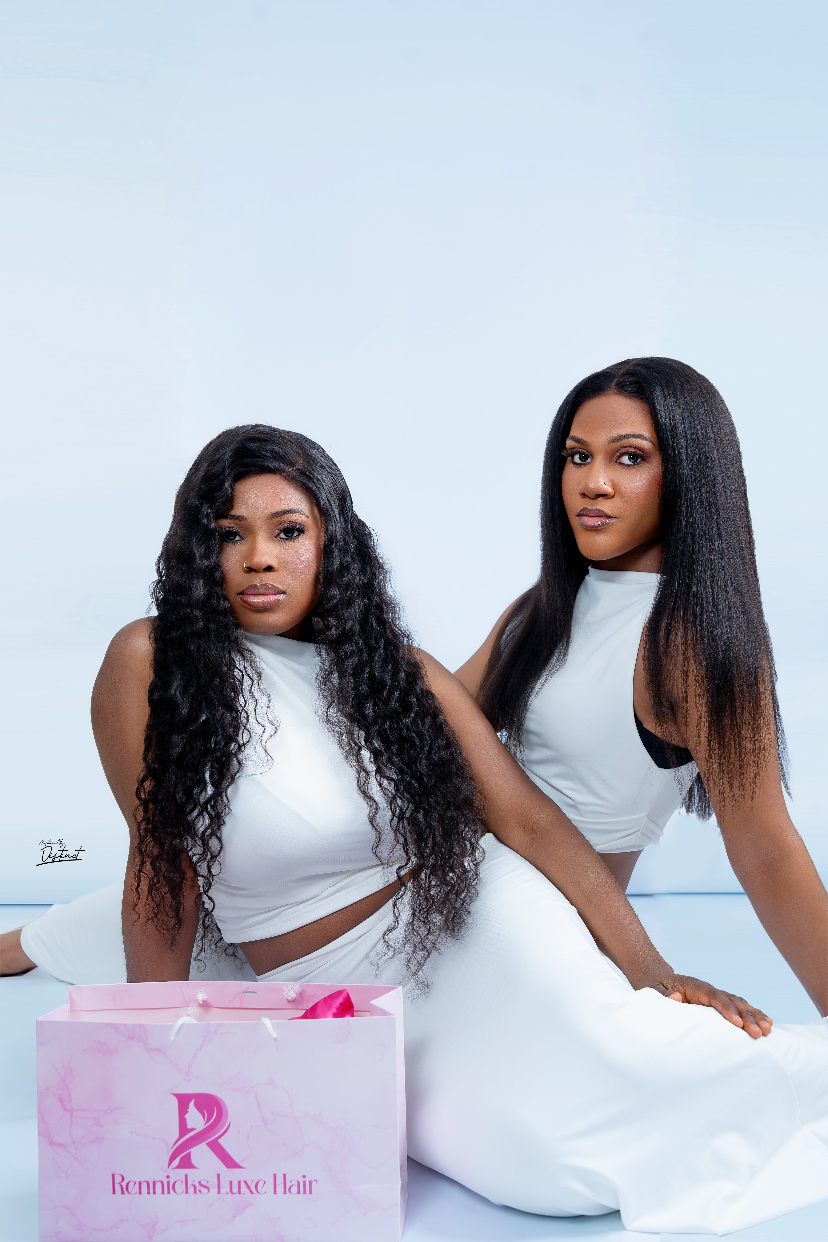 Rennicks Luxe Hair models in white styling luxury wigs